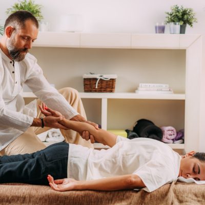 Shiatsu Hand Massage. Therapist Massaging the Heart Meridian.